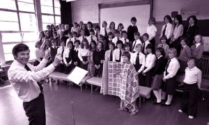 1978: Assistant head teacher John Cooper with the Smithfield Primary School Choir from classes P5, 6 and 7 practising for their production of Joseph and the Amazing Technicolor Dreamcoat, with Alan Wallace (P6) playing Joseph. Image: DC Thomson