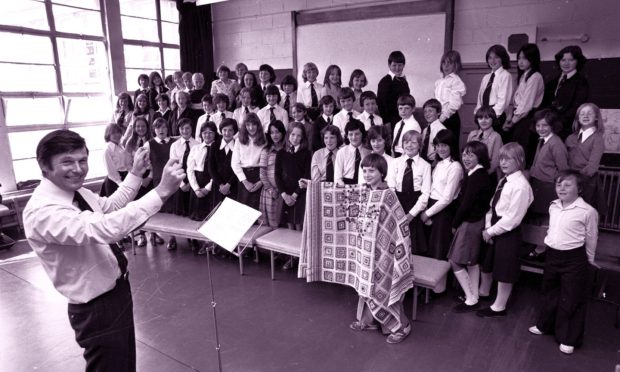 EE Memories. EE 3.6.2008.
CHARITY SHOW: Assistant head teacher John Cooper with the Smithfield Primary School Choir from classes P5, 6 and 7 practising for their production of Joseph and the Amazing Technicolor Dreamcoat, with Alan Wallace (P6) playing Joseph. The choir were raising funds for the Linburn Centre of the Scottish National Institution for the War Blinded.
ABERDEEN JOURNALS Ltd.
Used EE 9.6.1978. (78-3918).