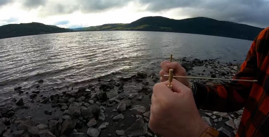 Extreme Ghost Hunter's dousing sticks on the banks of loch Ness