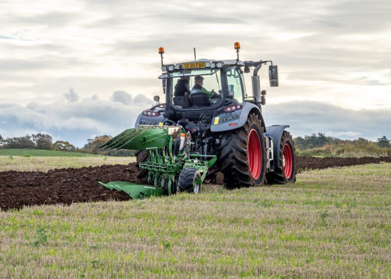 A Scottish tractor in mid-plough.