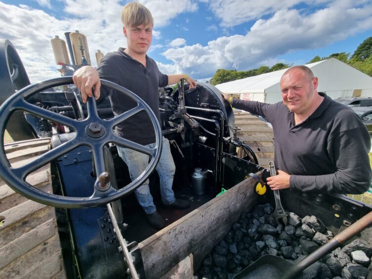 Graduate-apprentice Findlay Lawson and the owner of steam traction engine Erebus, Cameron Anderson sitting on Erebus.