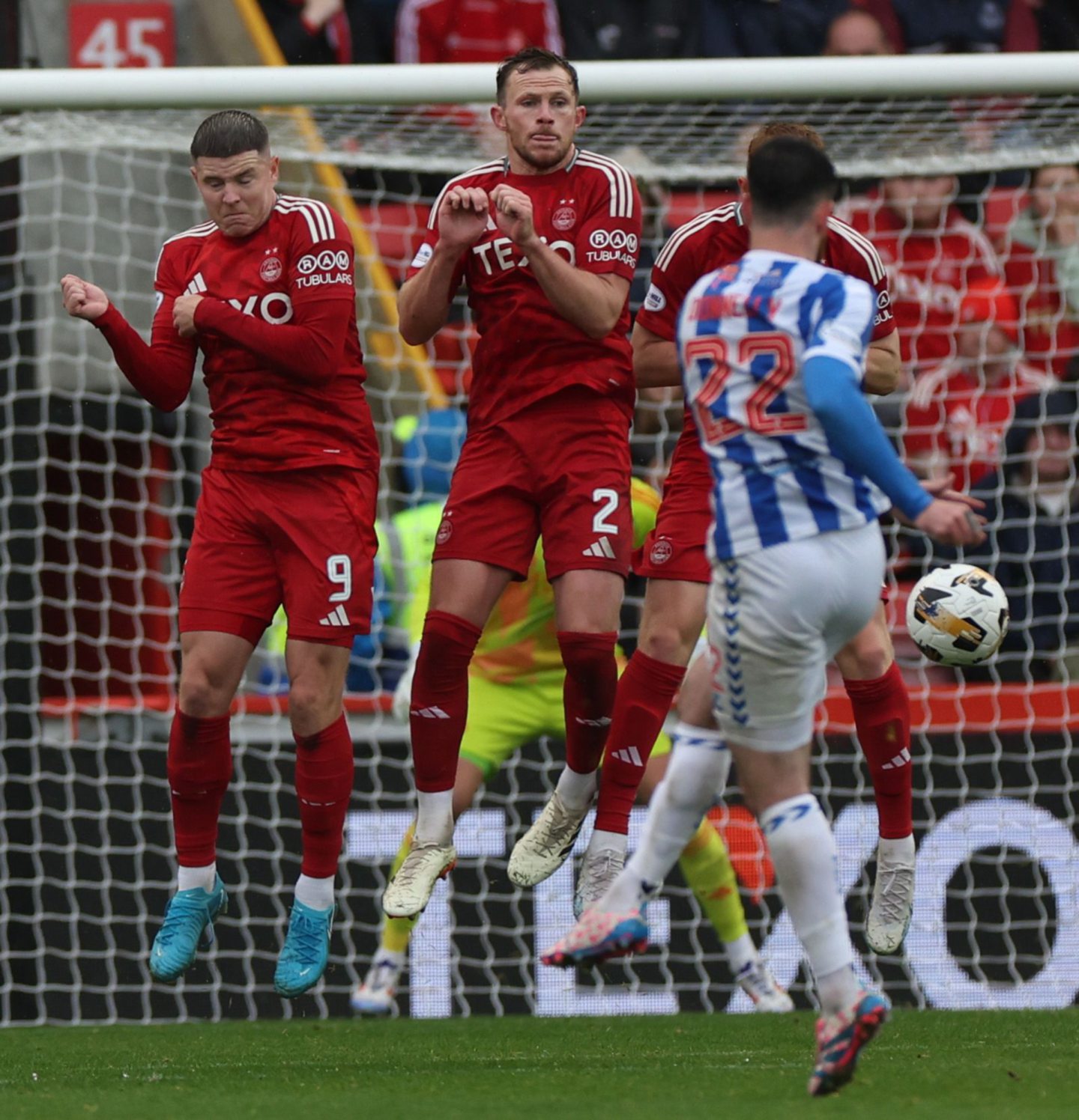 Aberdeen's Kevin Nisbet and Nicky Devlin defend a free kick in the 2-0 win against Kilmarnock. Image: Shutterstock