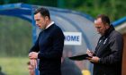 Don and Paul Cowie in the technical area during Ross County's Premier Sports Cup match against Stranraer. Image: SNS