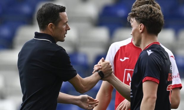 Don Cowie congratulates Aidan Denholm following his Ross County debut. Image: SNS.