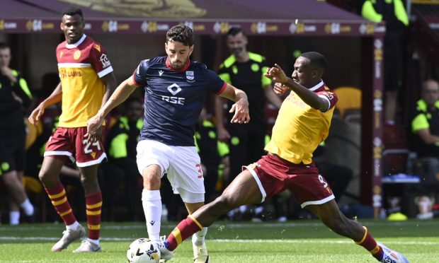 Will Nightingale in action for Ross County against Motherwell. Image: SNS