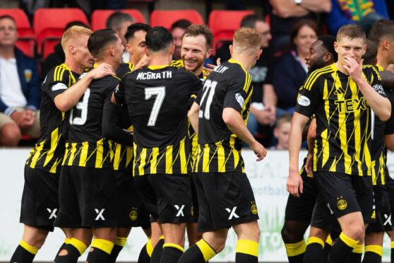 Nicky Devlin celebrates after scoring to make it 1-0  at St Johnstone. Image: SNS