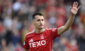 Aberdeen's Bojan Miovski tearfully says goodbye to the fans after the 3-1 defeat of St Mirren. Image: SNS