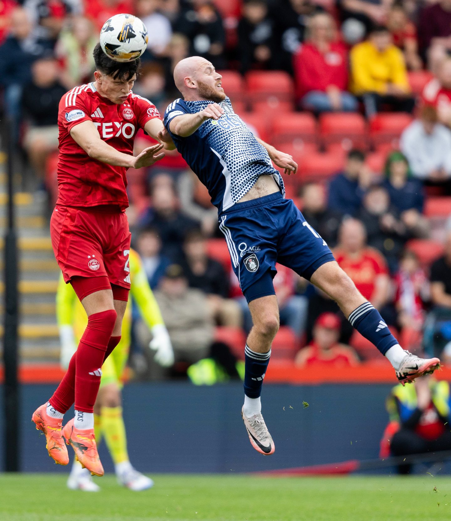 Aberdeen's Jack Milne and Queen's Park's Zak Rudden in action in the Premier Sports Cup. Image: SNS