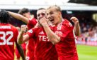 Aberdeen's Topi Keskinen celebrates with Graeme Shinnie after scoring the winner to beat Queen's Park 1-0 on his debut. Image: SNS