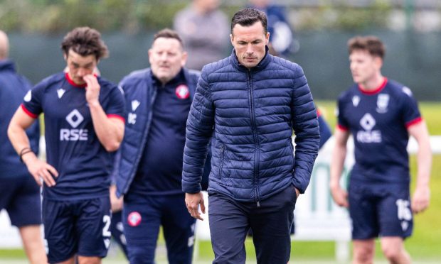 Don Cowie leads Ross County off the park following their shock loss to Spartans. Image: SNS