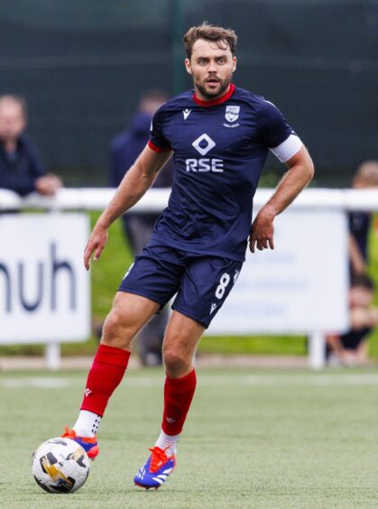 Ross County captain Connor Randall in action