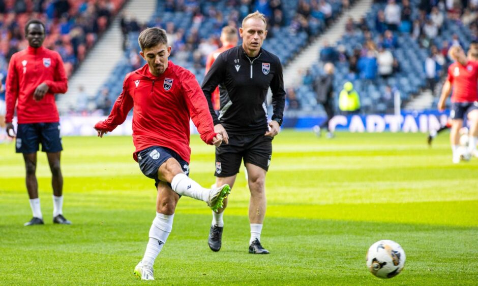 New Ross County signing Josh Nisbet warms up with a ball before the game against Rangers