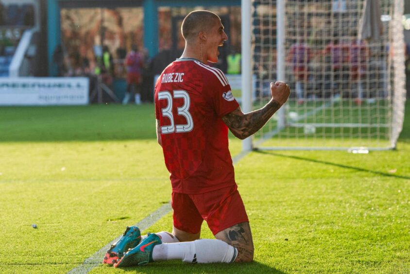 Aberdeen's Slobodan Rubezic celebrates before his goal is ruled out for offside following a VAR check against Ross County. Image: SNS