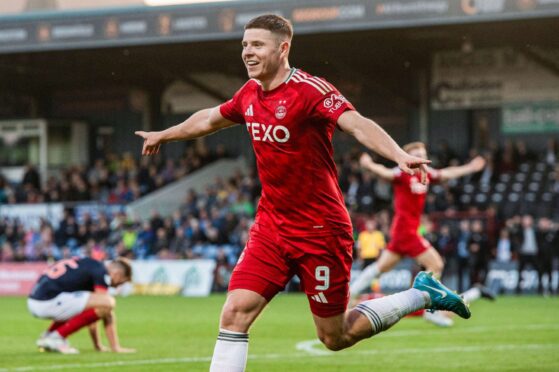 Aberdeen's Kevin Nisbet celebrates after scoring to make it 1-0 against Ross County. Image: SNS