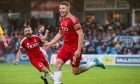 Kevin Nisbet celebrates his winner against Ross County. Image: SNS.