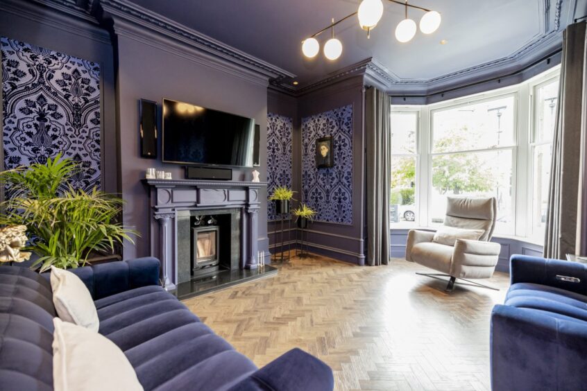 Living room at the renovated property in Aberdeen's west end, featuring dark herringbone flooring