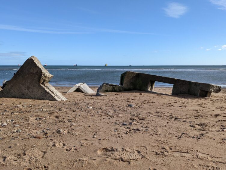 The second pillbox partly buried in the sand 