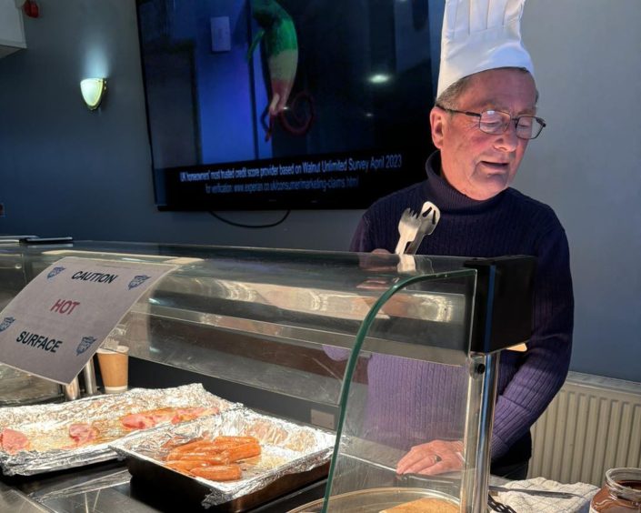 Club chairman Rodger Morrison used his previous experience as a chef to help out at the Sunday brunches. Image: Peterhead FC Community Foundation