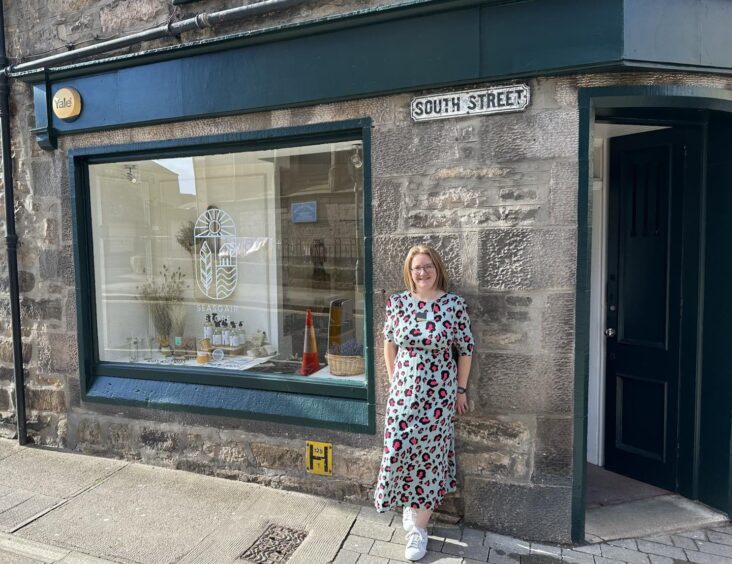 Sarah Holmes leaning on wall outside Seasgair 