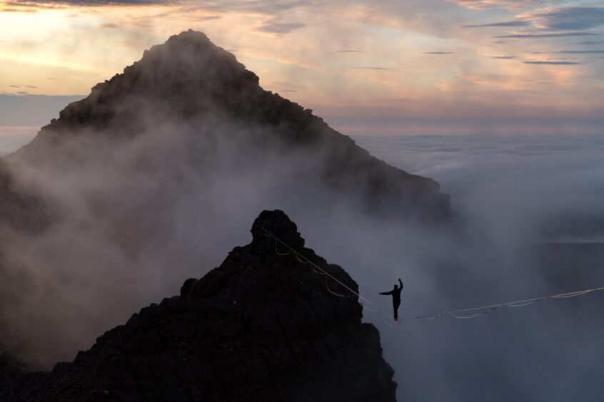 Owen highlining at An Teallach in Wester Ross.