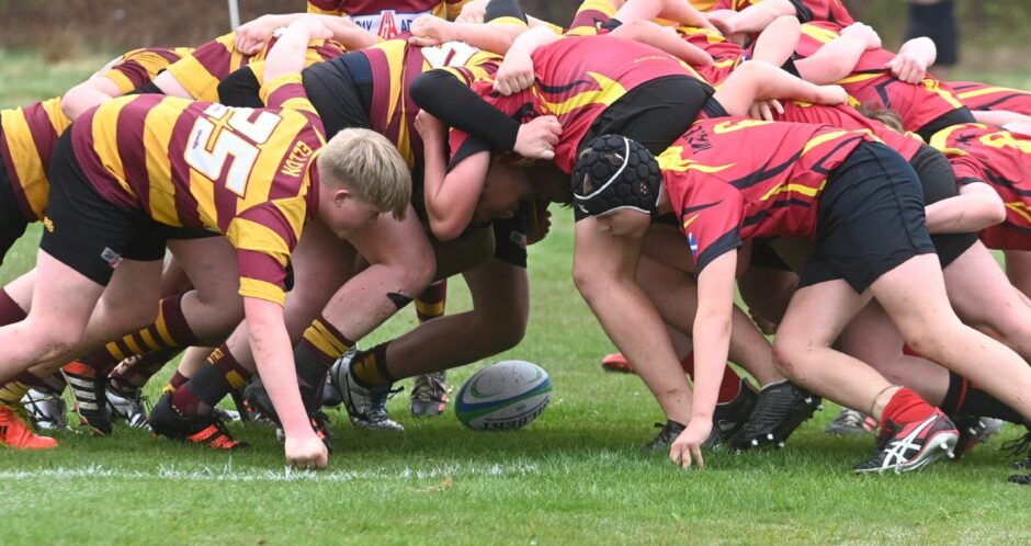 Scrum down: Youngsters from Ellon and Mackie compete for the ball at Sport Aberdeen's Sheddocksley ptiches - and the sports charity is sounding out rugby and hockey authorities about funding for artificial pitches in the Granite City. Image: Chris Sumner/DC Thomson