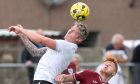 Clachnacuddin's Josh Meekings, left, wins a header under pressure from Matthew Tough of Keith. Pictures by Jasperimage.