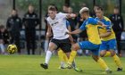 Clachnacuddin's Connor Bunce in action against Strathspey in the North of Scotland Cup. Image: Jasper Image.