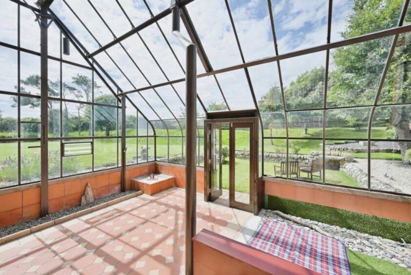 Glass conservatory with garden views 