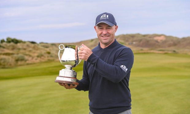 Robert Coles pictured with the trophy after winning the Staysure PGA Seniors Championship at Trump International Links.  Image: Darrell Benns/DC Thomson