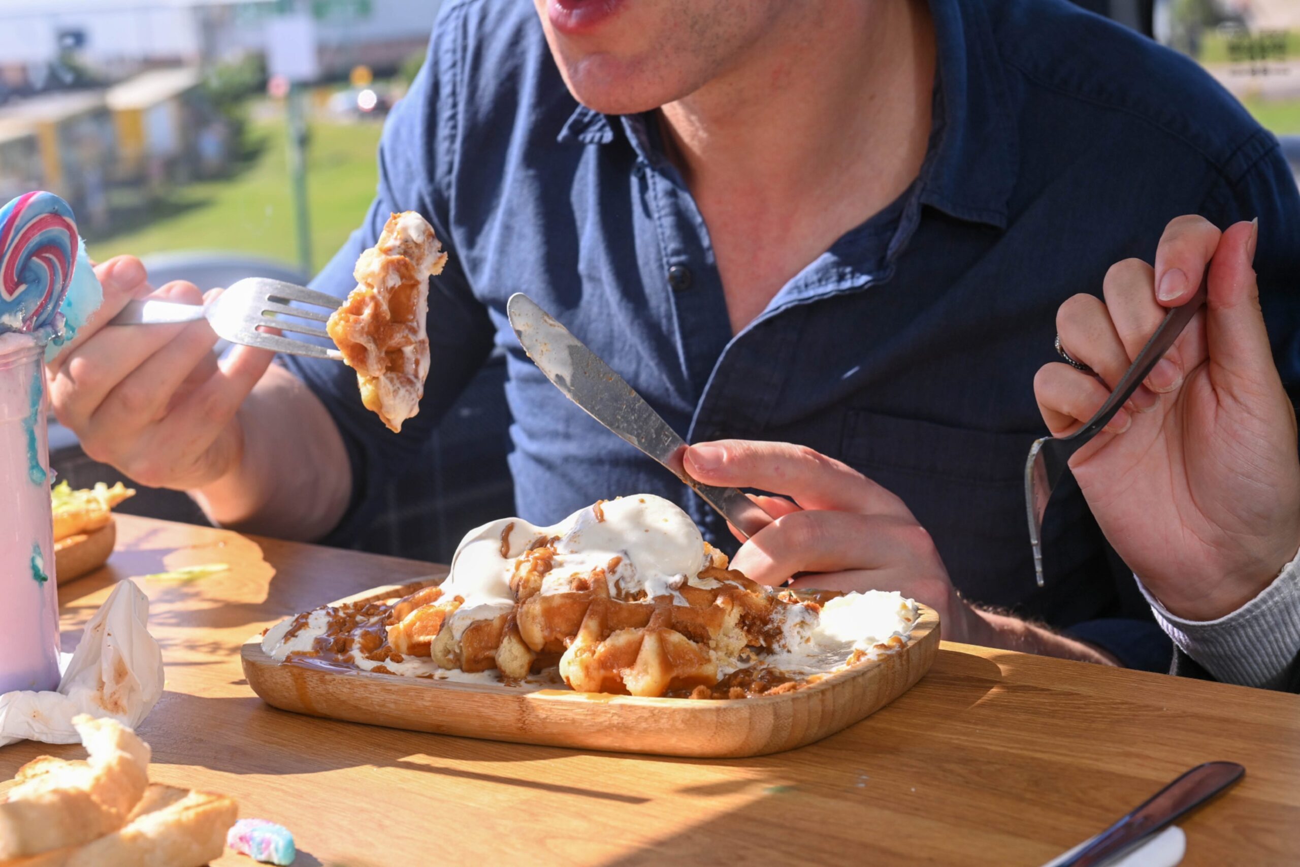 Andy tries the waffle.