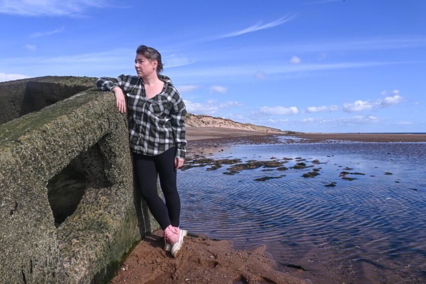 Jacqueline Willis with a pillbox on Donmouth Beach 