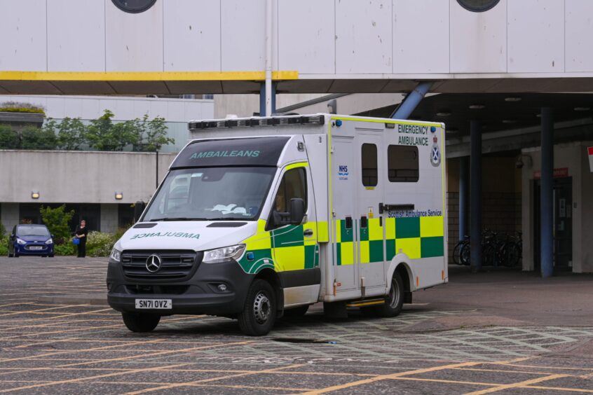 An image of an ambulance parked outside a hospital