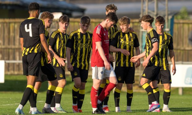 Alfie Stewart celebrates his free-kick opener for Aberdeen over Deveronvale. Image: Jasperimage.