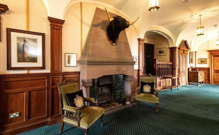 The large fireplace in the main hallway at Glenborrodale Castle