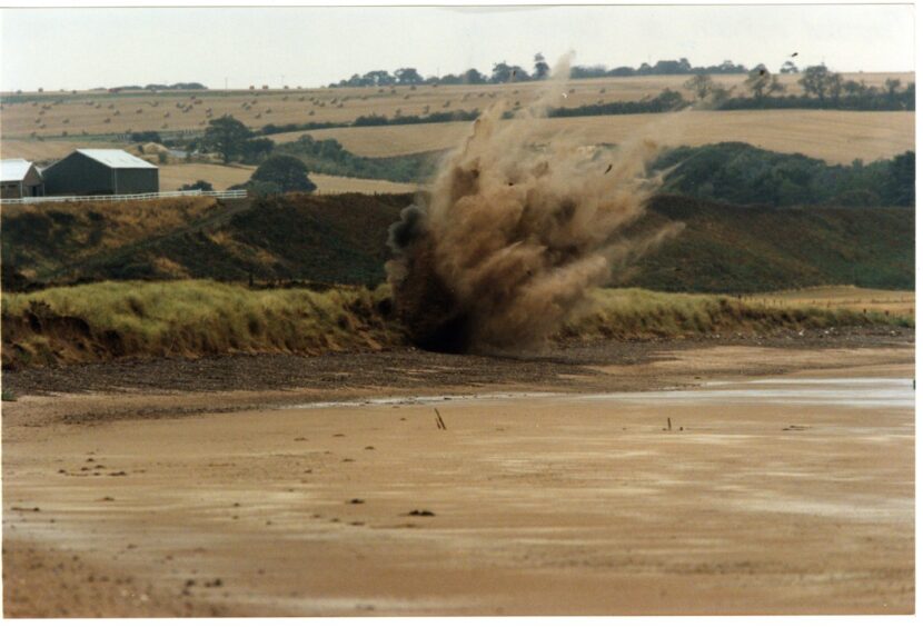 Explosion at Lunan Bay.Photograph showing a controlled explosion taking place at Lunan Bay. 3 October 1996.