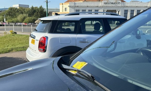 Parking fines left on vehicles at Aberdeen Beach spot. Image: DC Thomson.