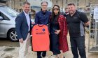 John W Henry, his wife Linda along with Lossiemouth United FC chairman, Alex Lauriston. Image: Jasperimage.