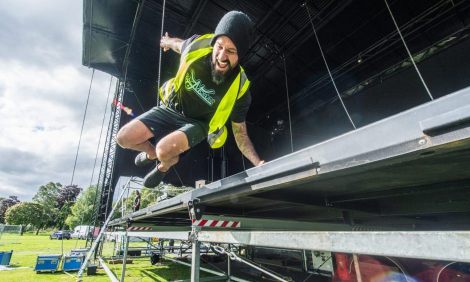 Andy Macdonald jumping off MacMoray stage. 