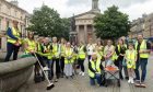 Volunteers in high-viz vests on Elgin Plainstones.