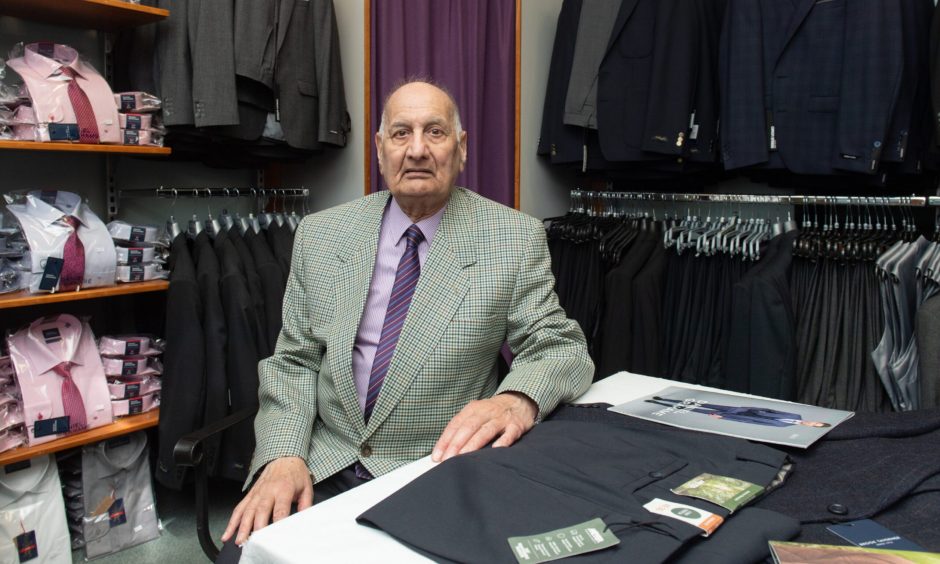 Ghulam Rasul inside Emporium Menswear. 