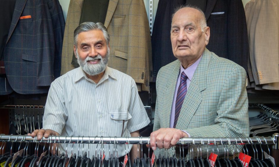 Nasir Mahmud and Ghulam Rasul in Emporium Menswear. 