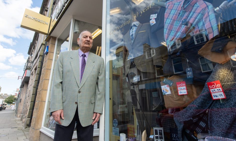 Ghulam Rasul outside Emporium Menswear. 