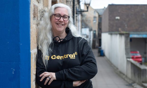 Lee Midlane in Elgin town centre wearing IT Central hoodie.