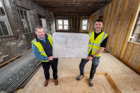 Pastor Graham Swanson and head contractor Edward Hawksley inside the former council offices getting transformed. Image: Jason Hedges/DC Thomson