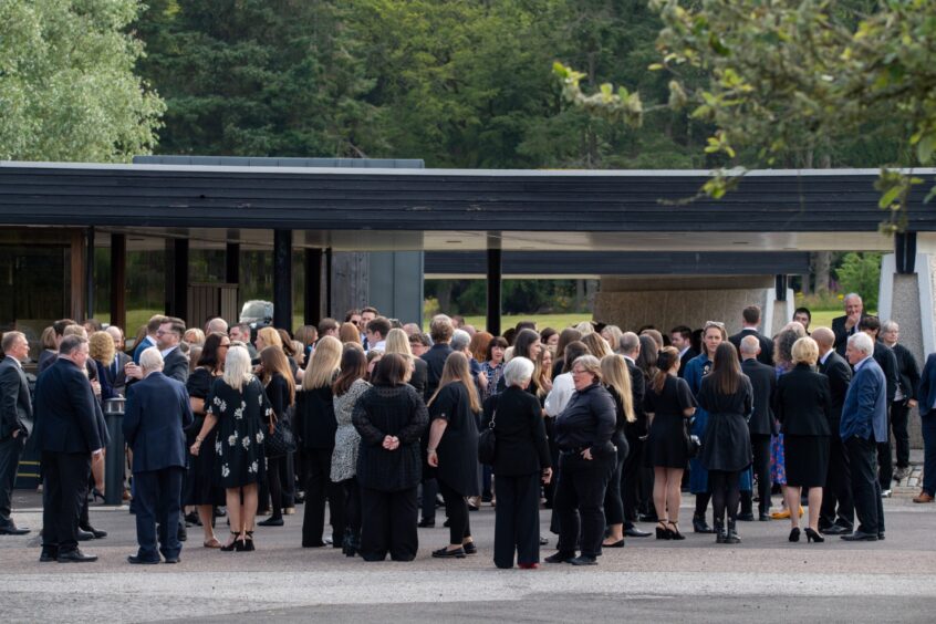 Mourners at Liz Milne's funeral.