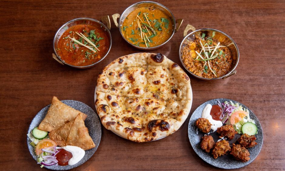 Our curry, naan and starters laid out on the table at Lahore Karahi