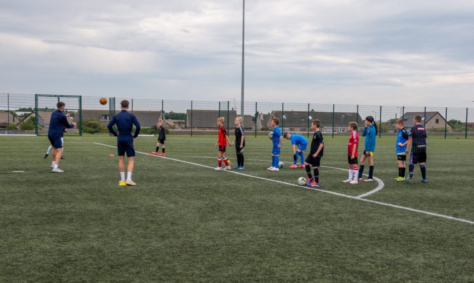 Danny and Arran have been coaching kids over the summer across from Balmoor Stadium. Image: Kath Flannery/ DC Thomson