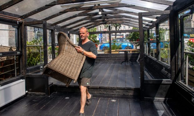 Steve Bothwell clearing his Cafe 52 pavilion.