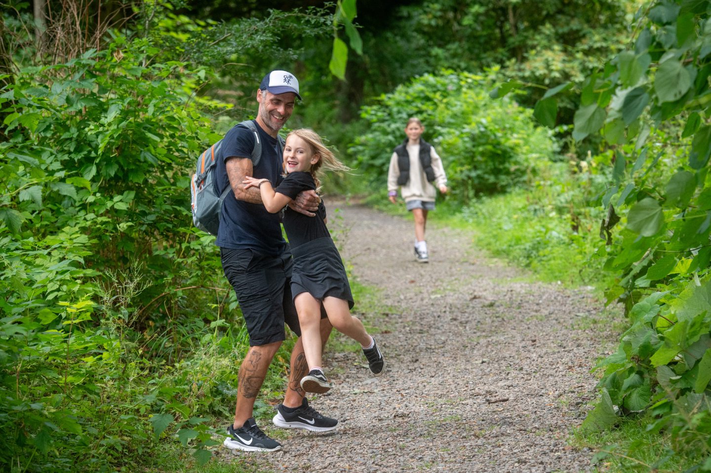  Matt Kinghorn walking in the woods at Pitmedden with his daughters Akira and Sorcha.