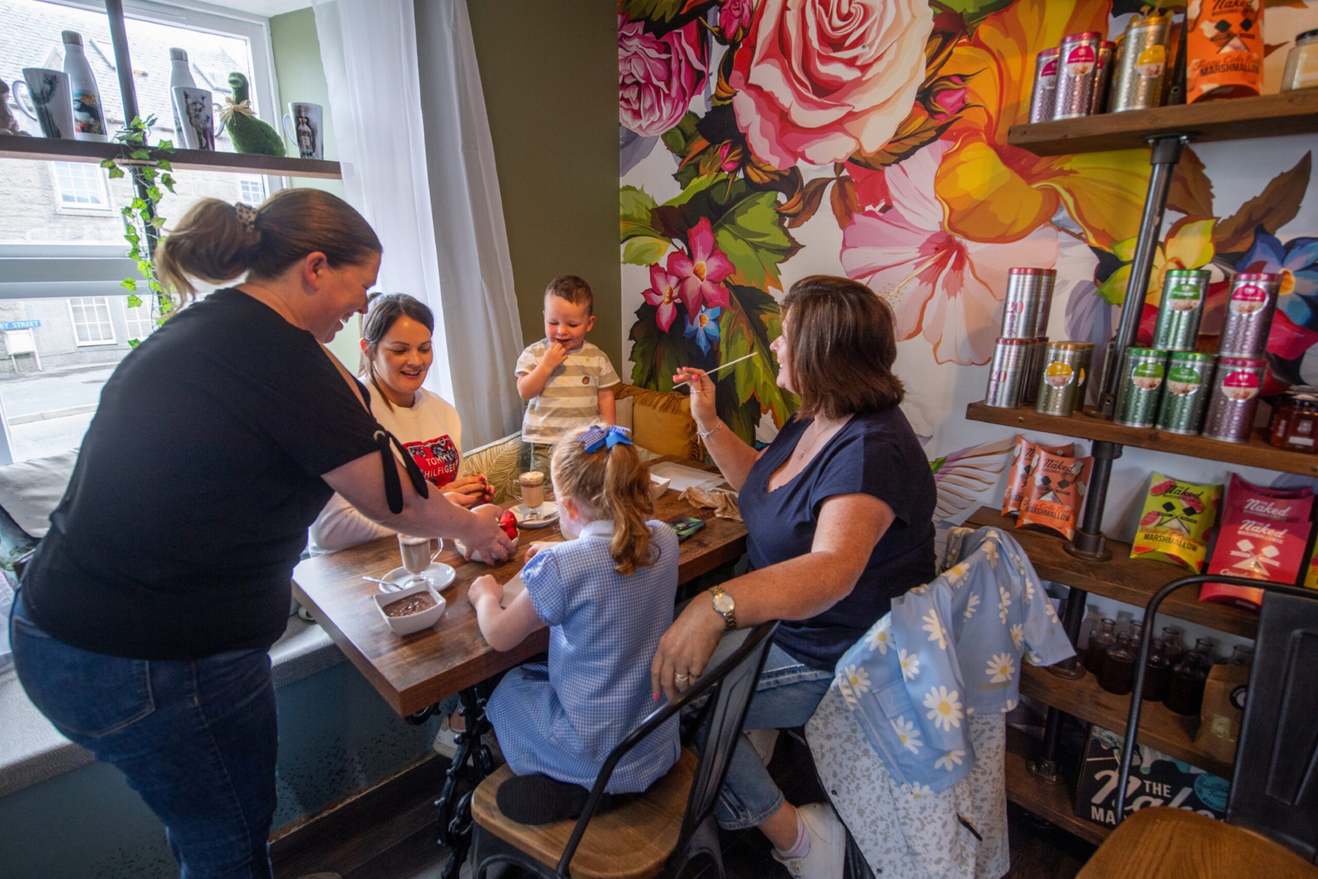 Kira serving customers at The Chocolate Bar cafe in Ellon.